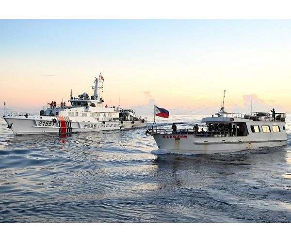 Philippine ship in standoff with China leaves flashpoint reef