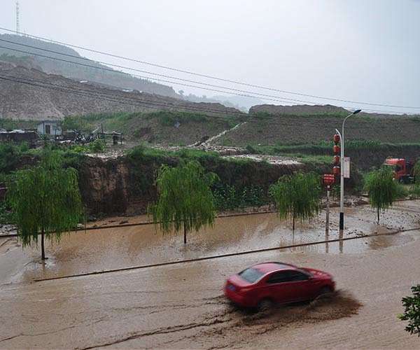 Floods for miles: swathes of China underwater after historic rain