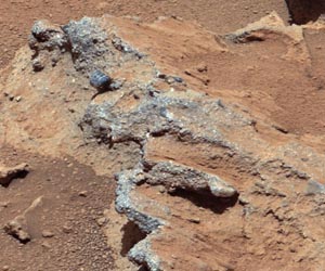 Flowing Water Transported Sand, Rocks Along Martian Streambed