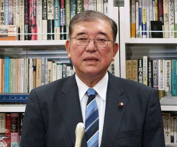 Japan PM vows to stay on despite election debacle