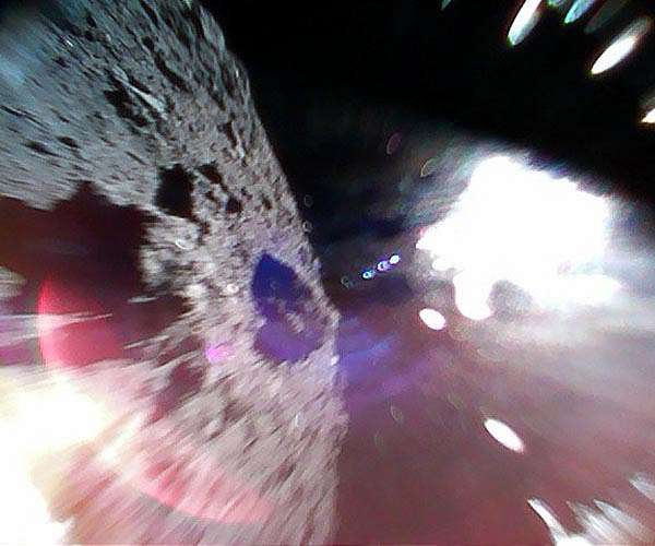 Hopping space dust may influence the way asteroids look and move