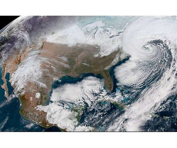 'Double whammy' of extreme weather grips both US coasts