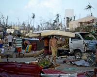 Philippines typhoon toll climbs as searchers dig for landslide missing