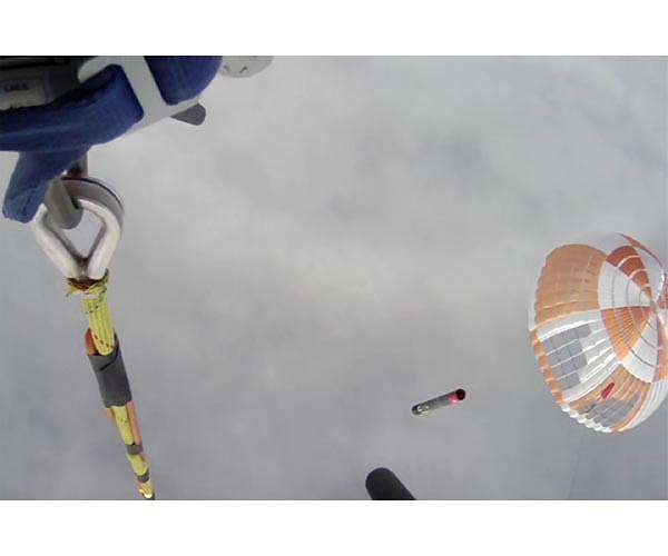 Rocket Lab catches rocket booster returning from space with helicopter