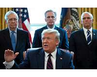 Trump signs $2 trillion recovery plan as US virus cases skyrocket
