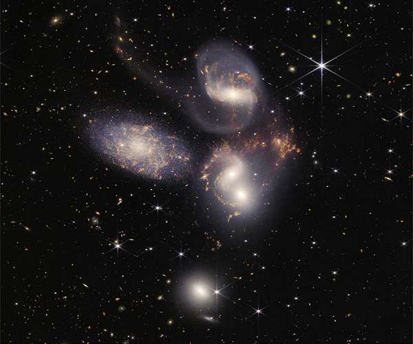 Cosmic cliffs and dancing galaxies: Webb begins era of discovery